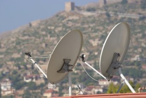 Satellite dish on the roof of a house with clipping paths